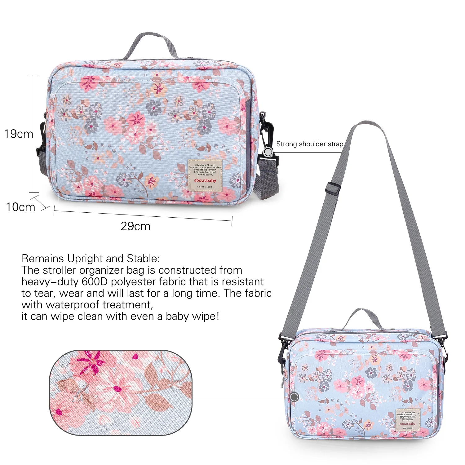 Un bolso organizador para cochecito de bebé con estampado floral. Está diseñado para acoplarse a un cochecito y tiene múltiples compartimentos para almacenamiento.