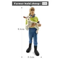 Farmer hold sheep