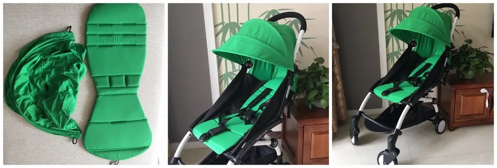 Un cochecito de bebé verde con capota. El cochecito está diseñado con una estructura negra y tiene un asiento y un dosel verdes, que probablemente estén hechos de una tela que brinda sombra y protección contra los elementos. El cochecito parece tener un diseño compacto, apto para uso urbano o de viaje.