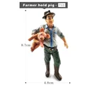 Farmer hold pig