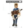 Farmer hold cow