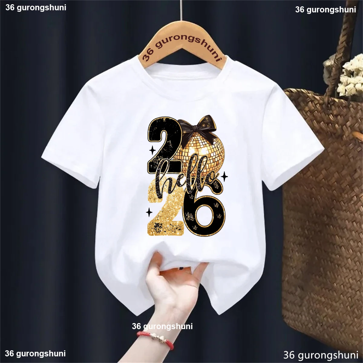 Camiseta con estampado de lazo rosa Golden Hello 2026 para niñas, camiseta de Feliz Año Nuevo, regalos de vacaciones, ropa Kawaii para niños, camiseta sólida - imagen 2