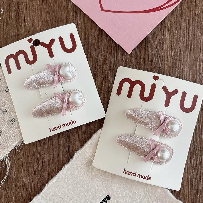 Versión coreana de terciopelo rosa, agradable arco de perlas, gota de agua para niños, Clip Bb, flequillo lateral, horquilla versátil para niñas