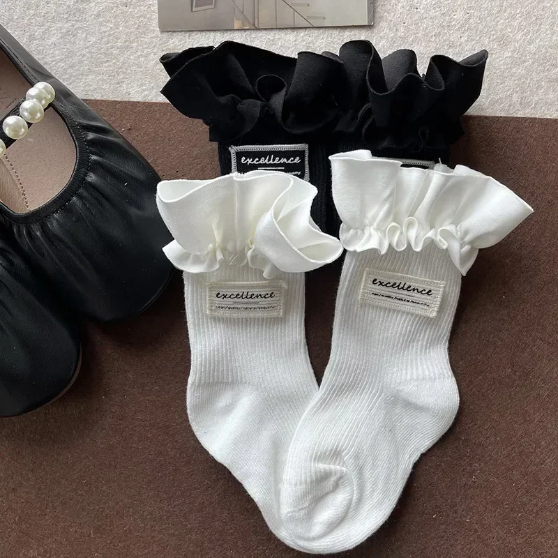 1 par de calcetines sencillos a la moda Ins para niños, calcetines hasta la pantorrilla para niña, calcetines con volantes de Color blanco y negro para niños, calcetines escolares de primavera de algodón suave - imagen 3
