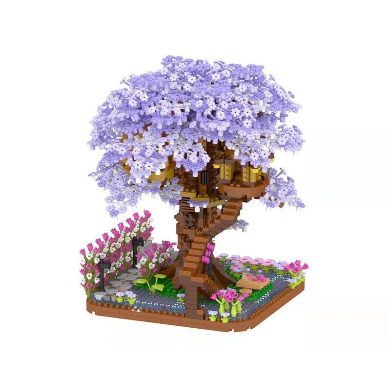 Un árbol morado con una casa y un jardín