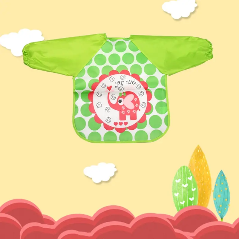 Una colorida ilustración del babero de un niño. El babero tiene un fondo verde con un estampado de lunares verdes y blancos. En el centro, hay un gráfico de un elefante rosa con una trompa a rayas rojas y blancas, rodeado por un borde de lunares rojos y blancos.
