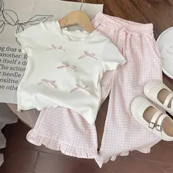 Conjunto infantil blanco-rosa con lazo: top y pantalón a cuadros