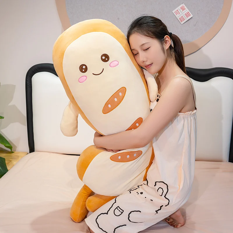 Almohada peluche tostada larga con cara sonriente para dormir - imagen 5