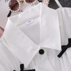 Blusa de manga larga con lazo para niña