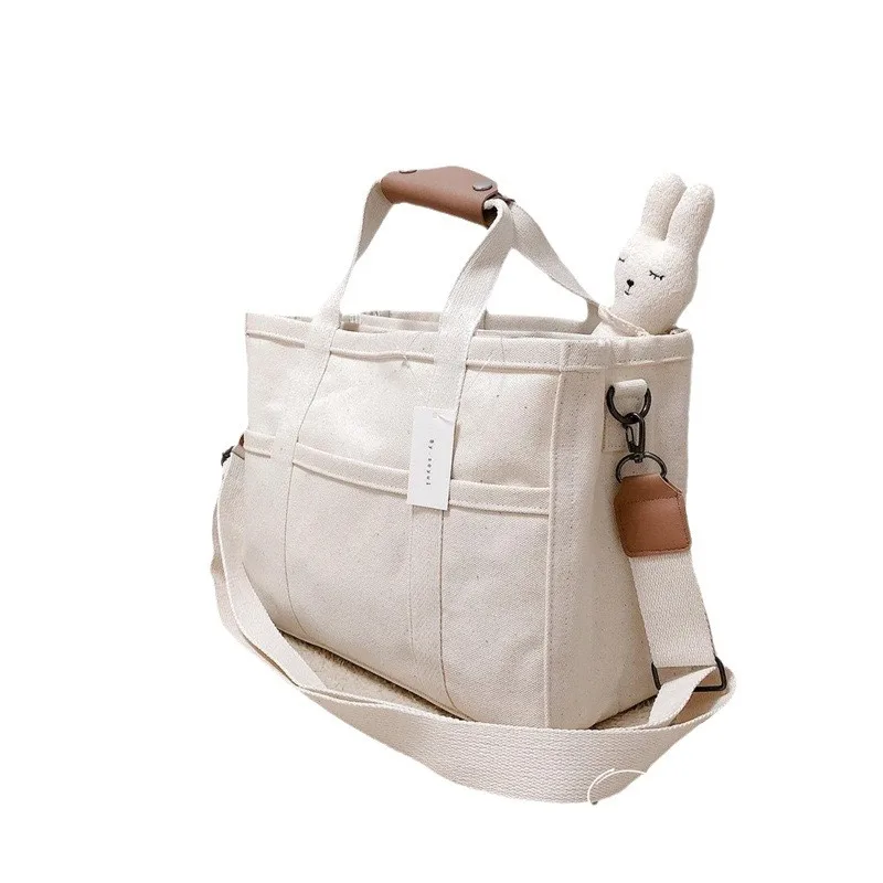 Bolsa de pañales para bebés para mujeres INS simplicidad Color Beige negro bolsa para cochecito portátil de gran capacidad bolsa de almacenamiento de cosas para bebés - imagen 5