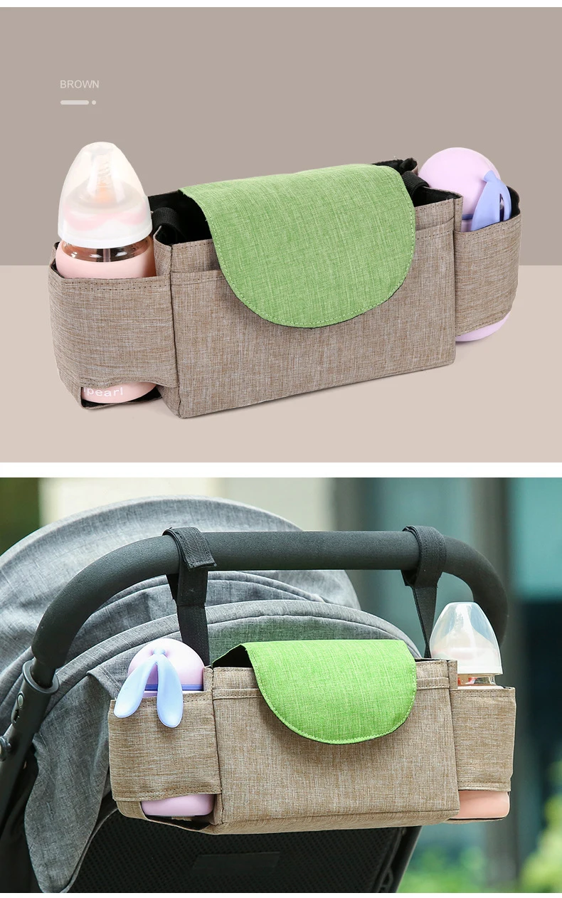 Bolsa para pañales de bebé con varios compartimentos. En la parte superior se ve el bolso con sus compartimentos abiertos, dejando al descubierto un interior verde. En el interior, hay compartimentos que parecen estar diseñados para guardar artículos esenciales para el bebé, como biberones, pañales y otros artículos.