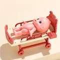 baby with pink bed