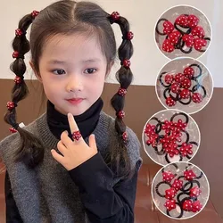 Lazos de lunares rojos y coleteros elásticos para niñas