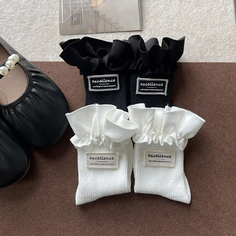 1 par de calcetines sencillos a la moda Ins para niños, calcetines hasta la pantorrilla para niña, calcetines con volantes de Color blanco y negro para niños, calcetines escolares de primavera de algodón suave - imagen 4