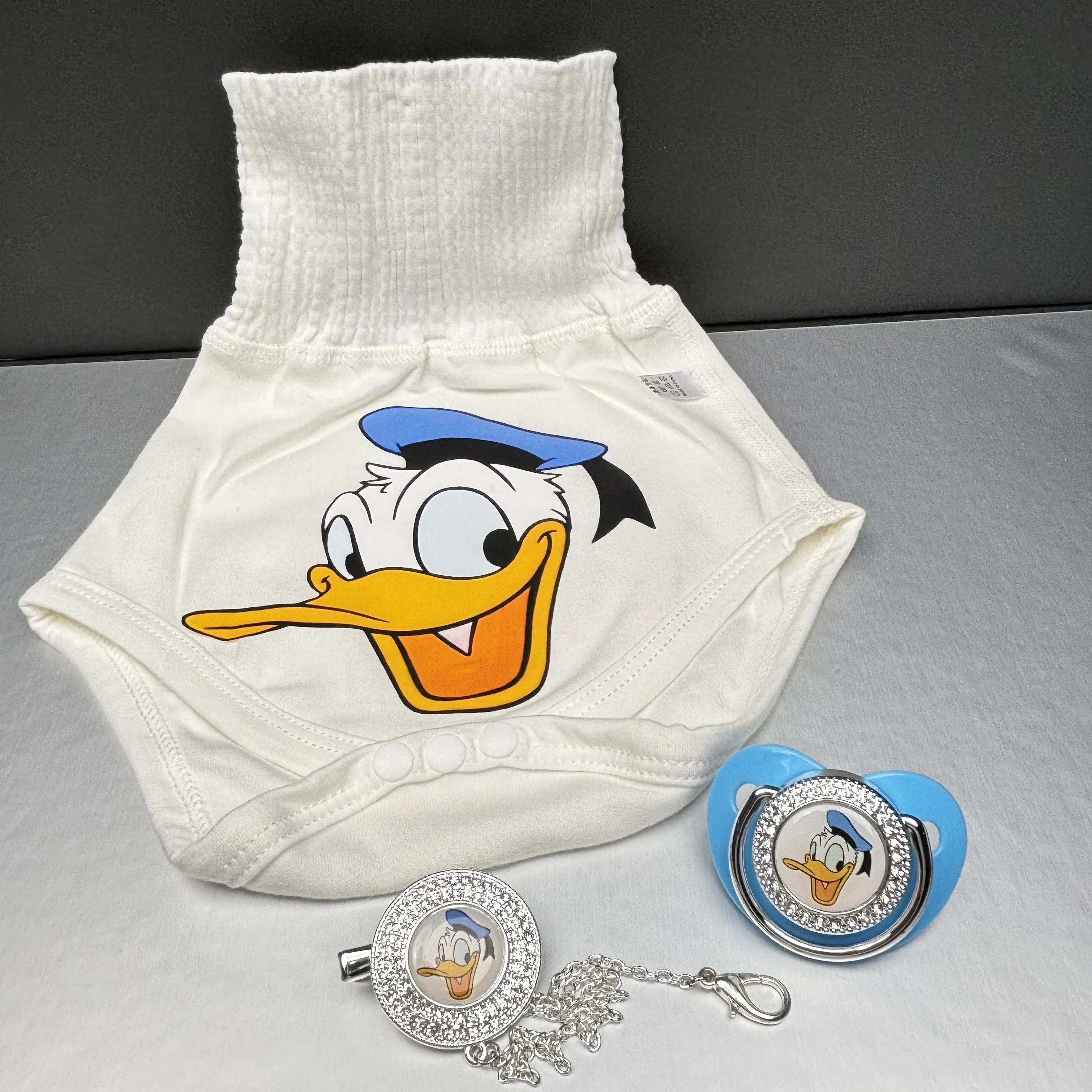 [1 Juego de pantalones para gatear Donald Duck + chupete + cadena] Productos de alimentación de bebé chupetes de bebé regalos de baño de bebé de lujo 0-24 meses - imagen 2