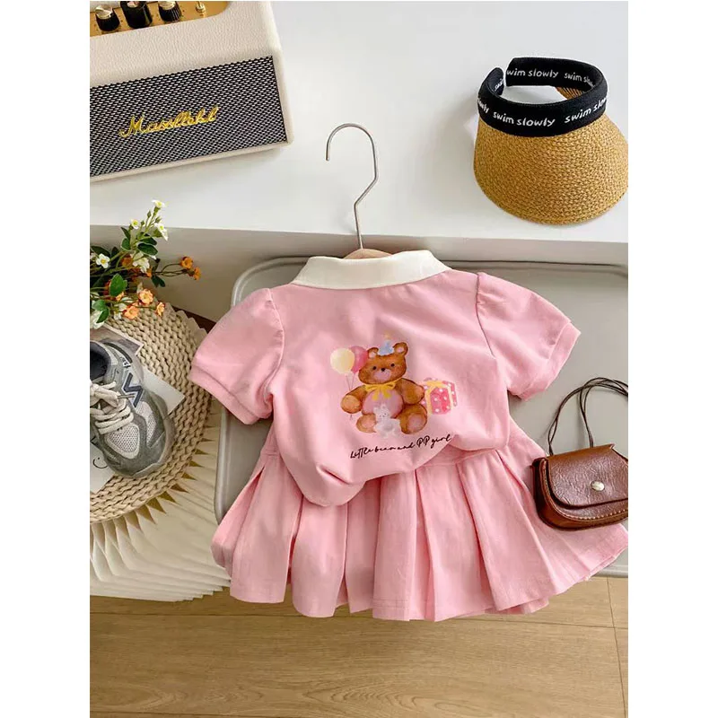 Conjunto niña verano top manga corta con solapa y falda ligera - imagen 2