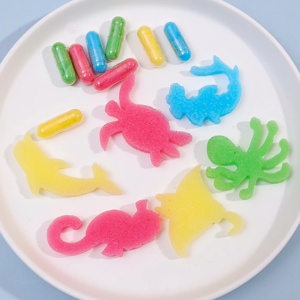 12 unids/set creativo agua de remojo expande a cápsula de esponja grande juguetes dinosaurio mar forma de Animal niños baño natación rompecabezas Juguetes - imagen 4
