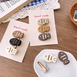 Pinzas pelo niños forma pez taiyaki – Diseño coreano beige con dibujos animados