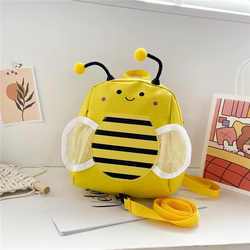 Mochila escolar de dibujos animados para niños, bolsa antipérdida para bebés, color amarillo y rosa, bolso de hombro para niños y niñas - imagen 2