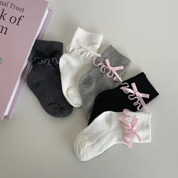 1 par de calcetines coreanos sencillos y bonitos para bebé, calcetines hasta la pantorrilla con lazo y volantes de Color sólido para niña, calcetines de algodón suave para primavera y otoño