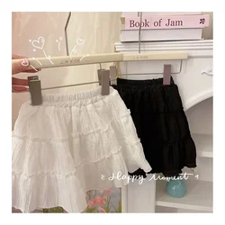 Falda corta con cintura elástica para niñas pequeñas, moda coreana, pantalones cortos bonitos de Color sólido, faldas de pastel de encaje para niños 2026