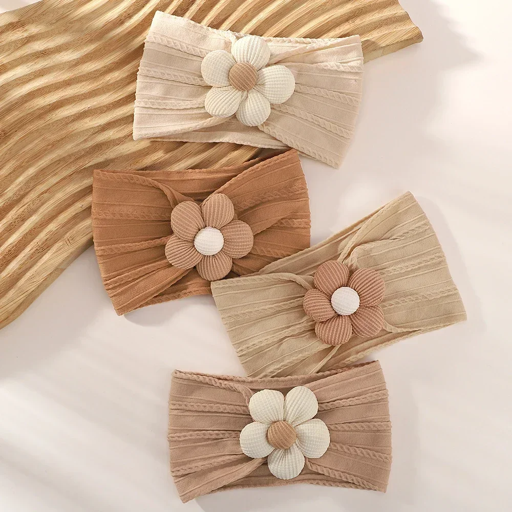Diadema floral elástica Astique para bebé y niña