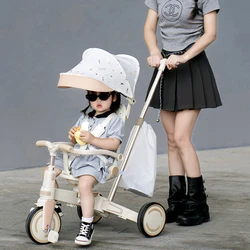 Coche triciclo infantil ligero con asiento reversible