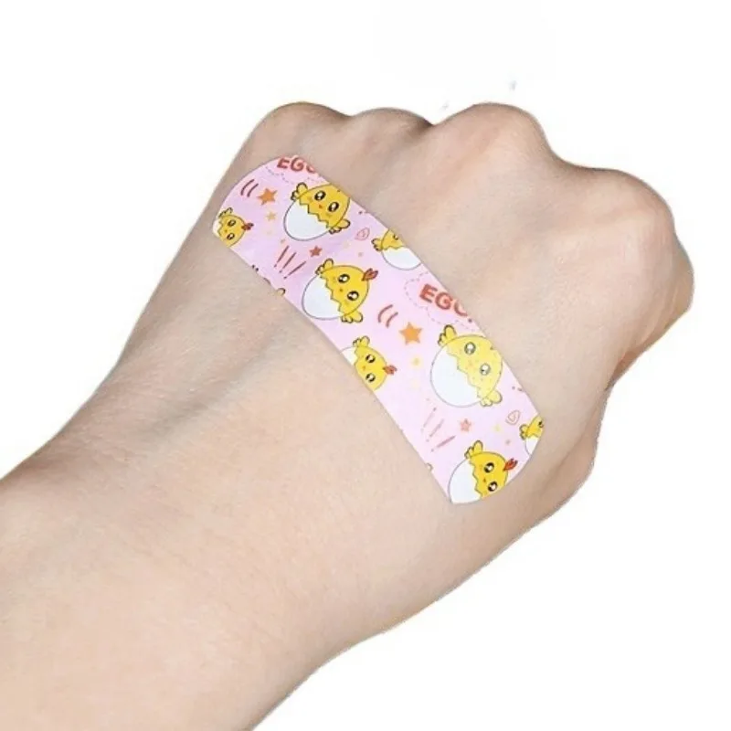 100 unids/set tirita de dibujos animados yesos lindos patrón aleatorio parche para vendaje de heridas en la piel para niños tiras de primeros auxilios Woundplast - imagen 3