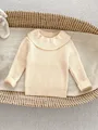 beige shirt