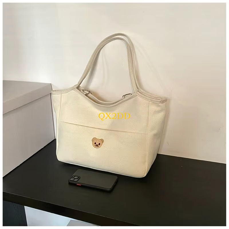 Bolsa pañales algodón con bordado de oso y bolsillos impermeables