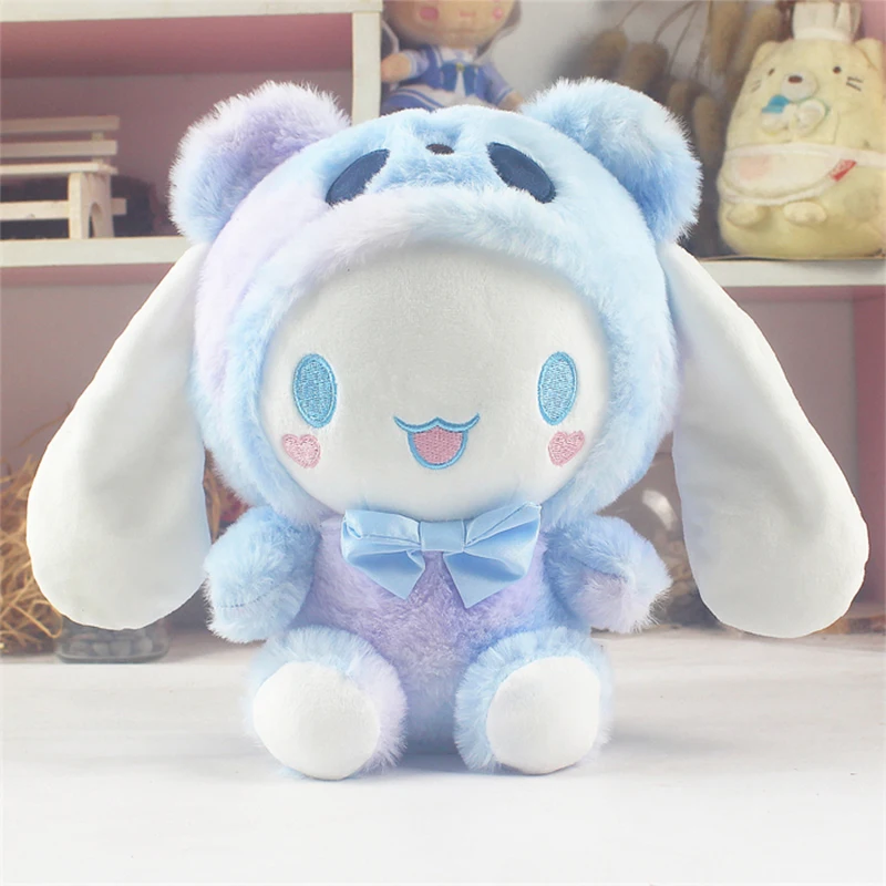 Un animal de peluche azul y morado con pajarita