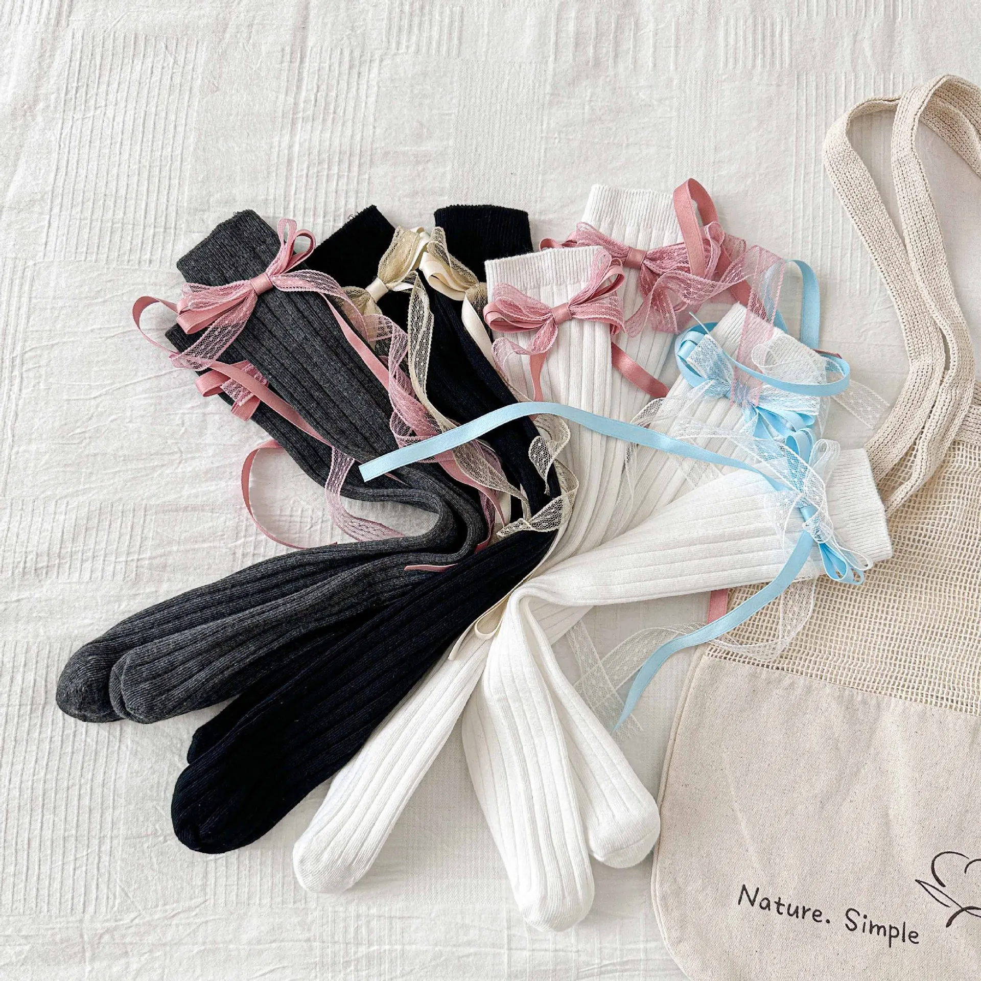 2026 calcetines de primavera para niñas, calcetines dulces de longitud media para niñas, calcetines largos con lazo estilo Corán, calcetines con borlas para niños