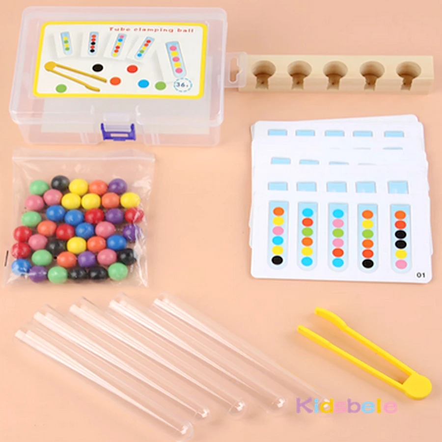 Conjunto completo de tubos, bolas y tarjetas en una caja de madera
