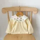 yellow blouse