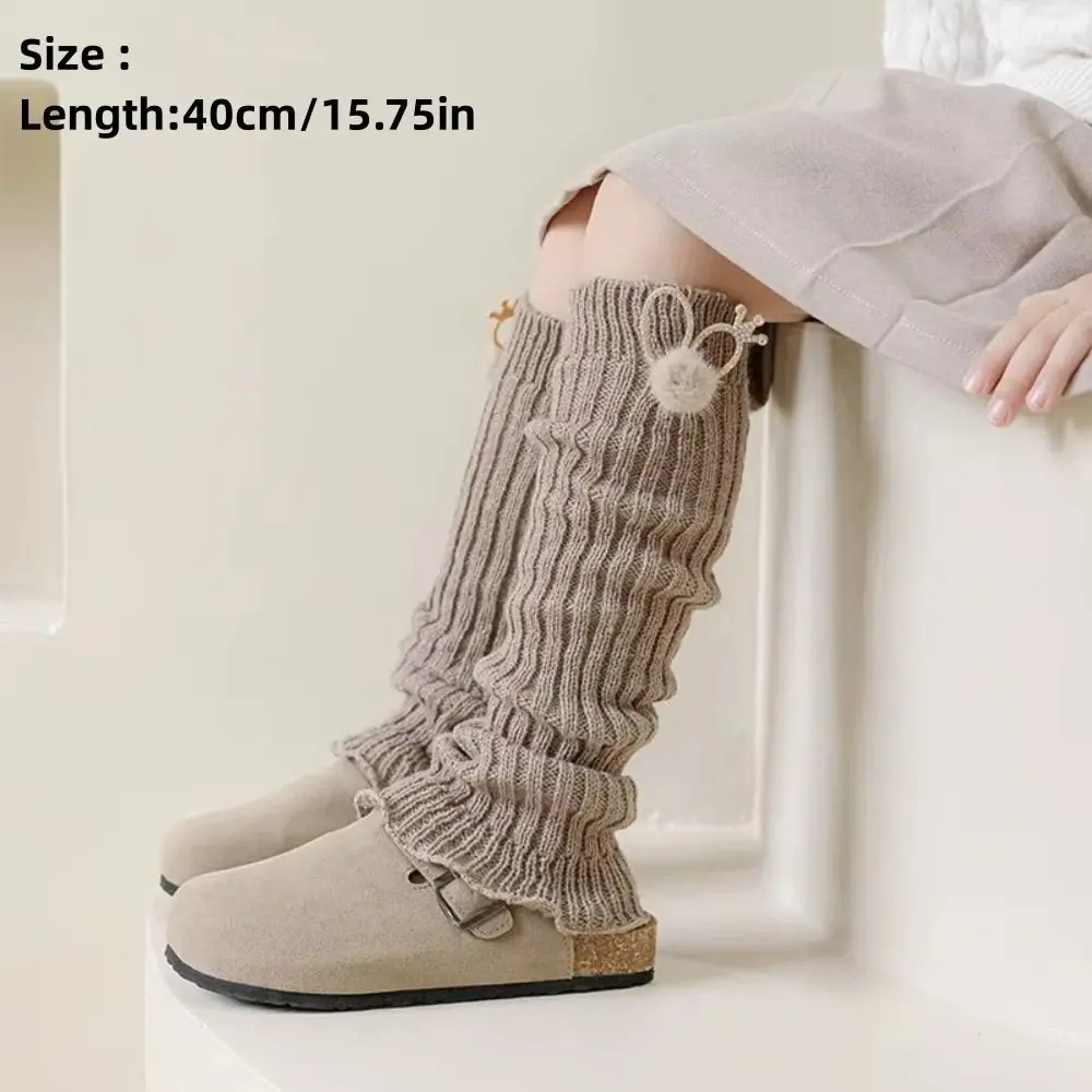 Leg warmers con orejas de conejo en tono blanco