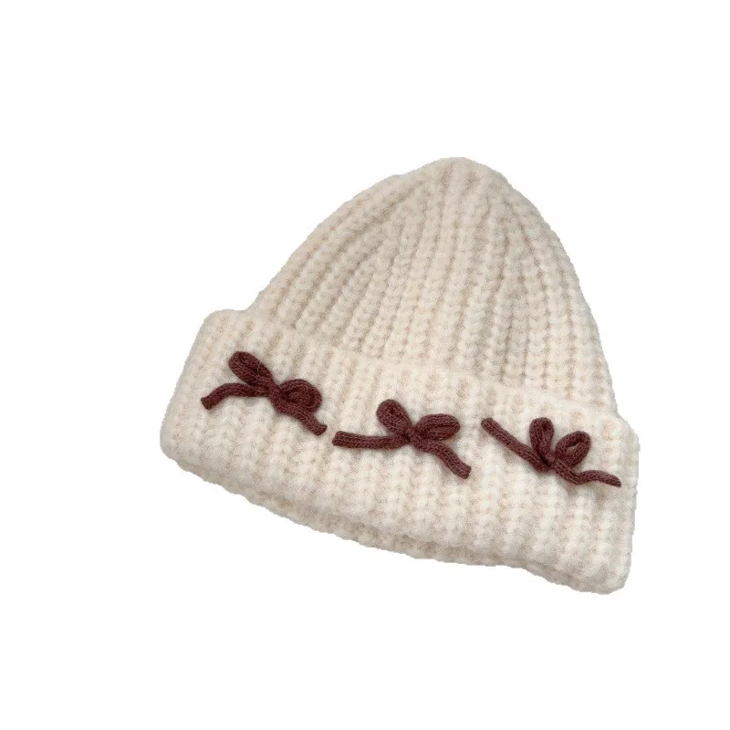 ¡Sombrero de punto suave para niños de estilo coreano! Almohadillas gruesas con bonito lazo, diseño versátil a prueba de viento, cálido y cómodo, elegante. - imagen 5