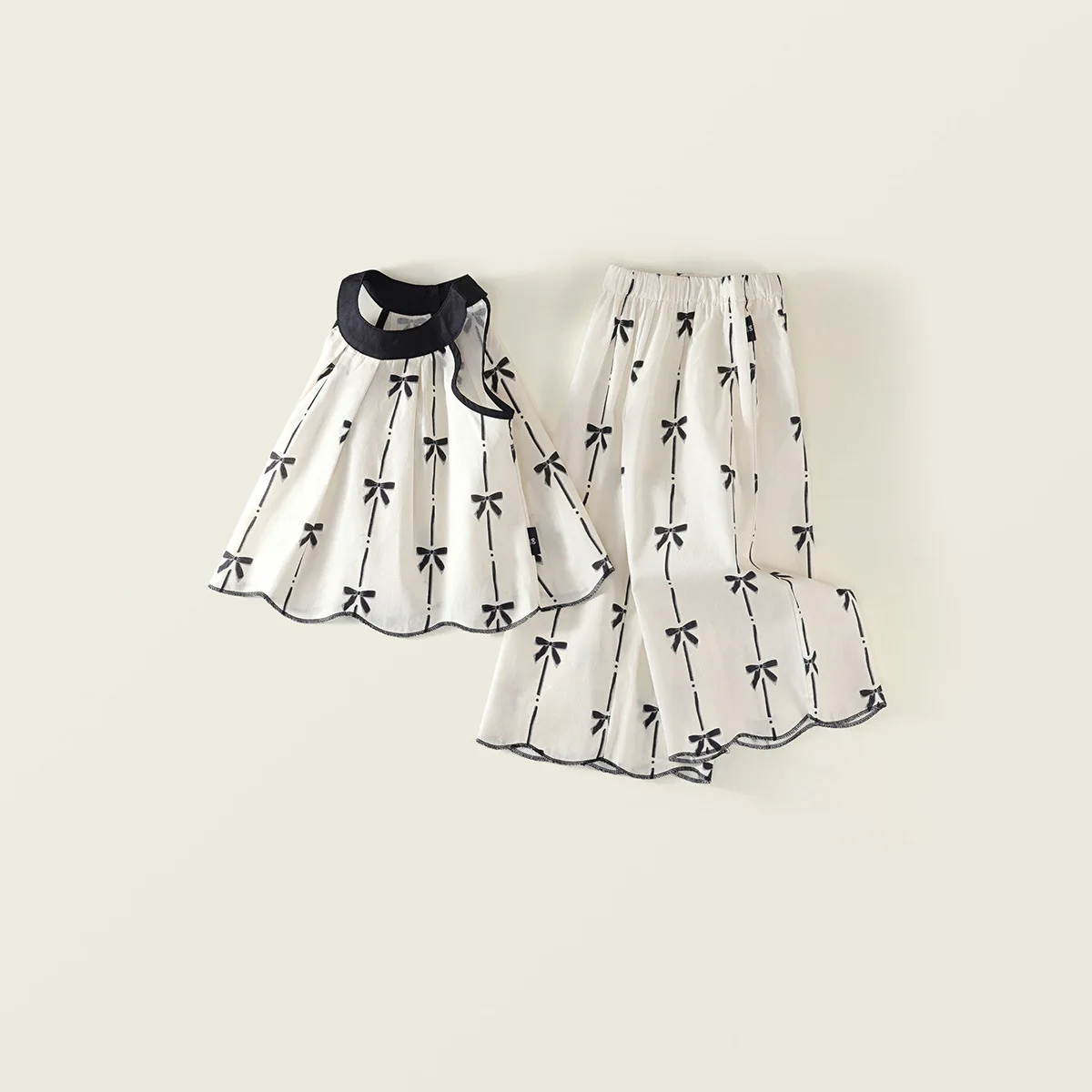Conjunto niña: top sin mangas con lazo estampado y pantalón suelto - imagen 5