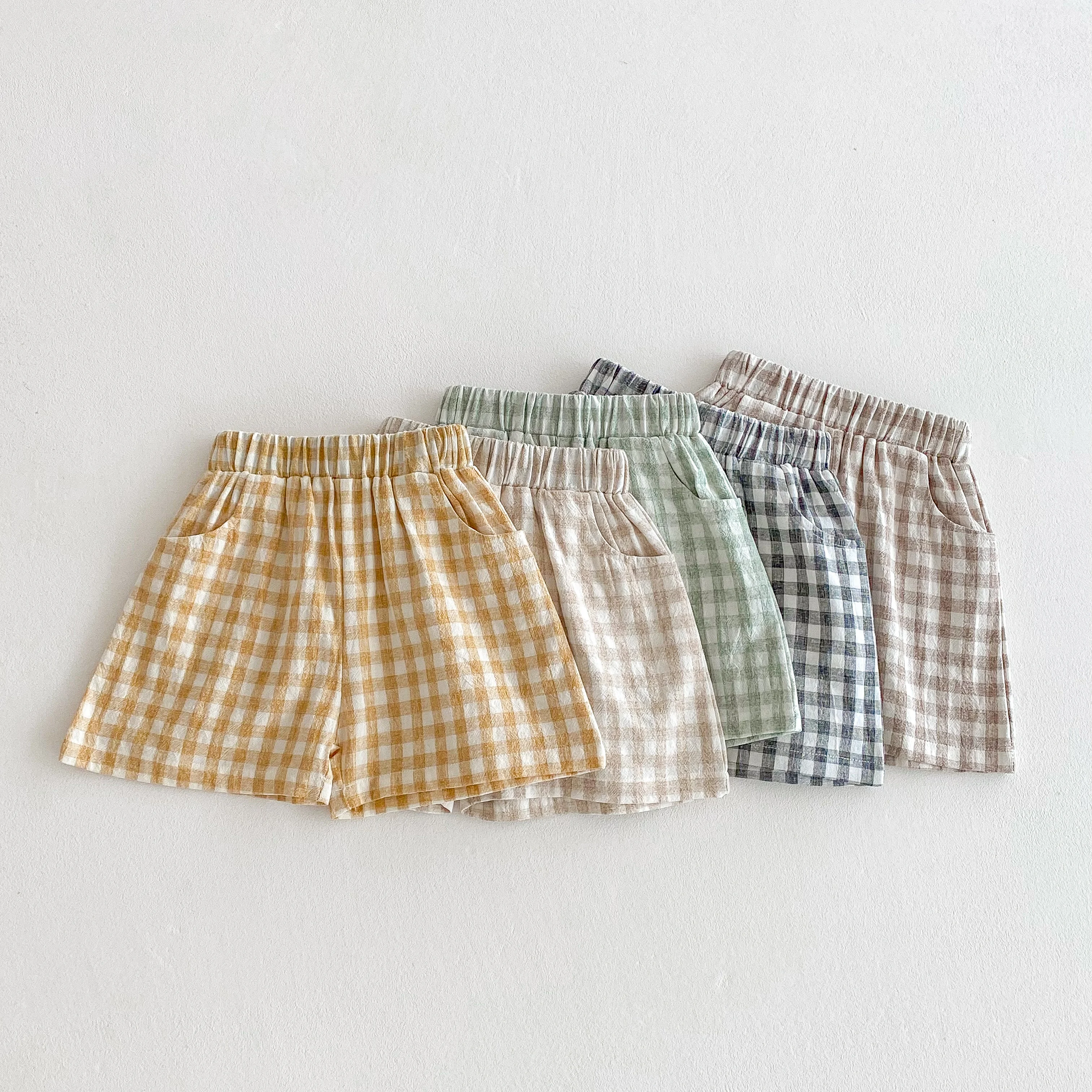 Pantalones cortos verano para bebés de lino cuadros holgados unisex