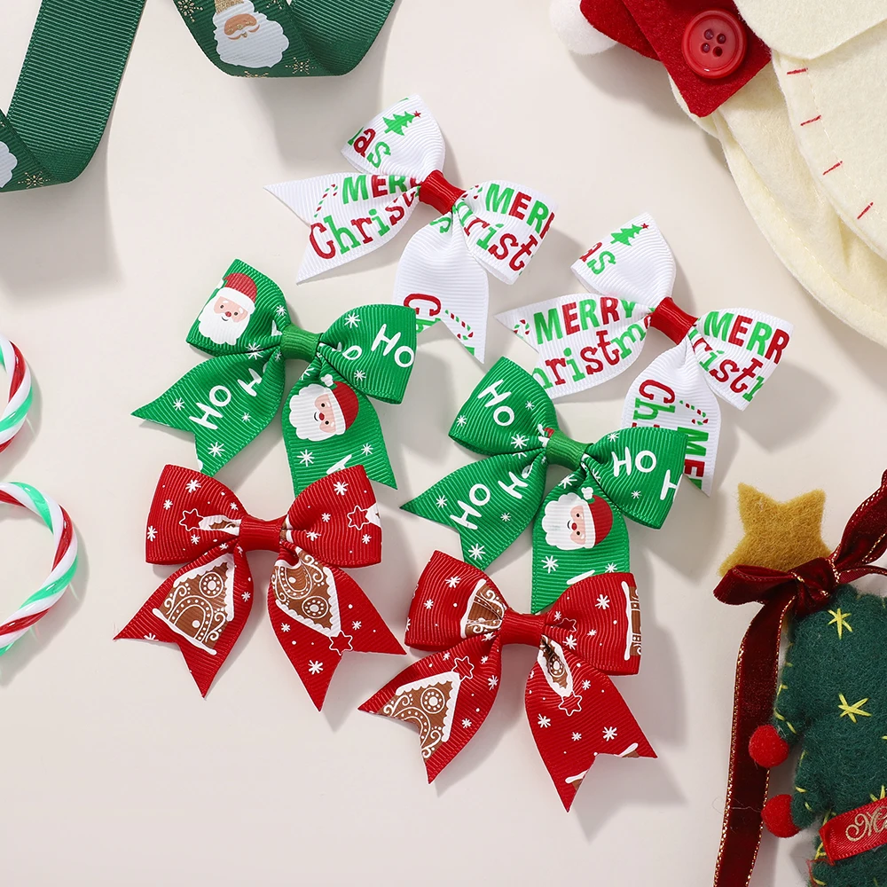 Pinzas pelo navideñas niña con lazo Papá Noel y alce