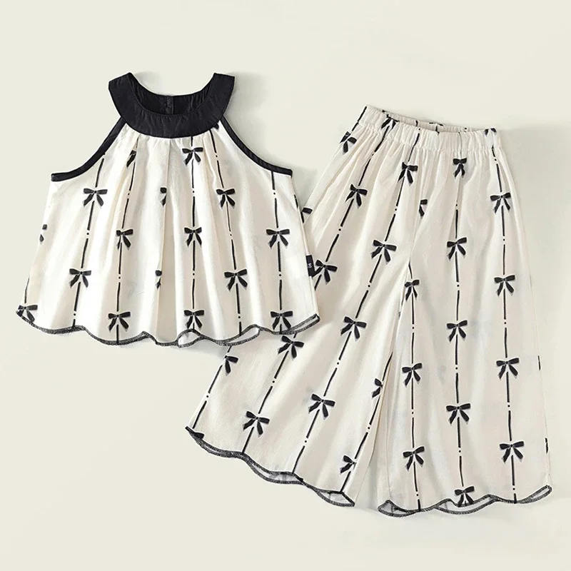 Conjunto niña: top sin mangas con lazo estampado y pantalón suelto