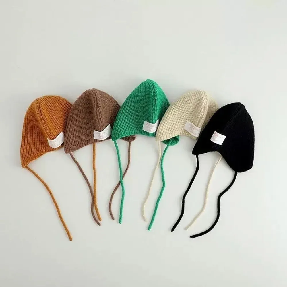 Conjunto bebé jersey de punto y gorro con protección auditiva - imagen 5