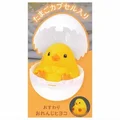 orange chick sits