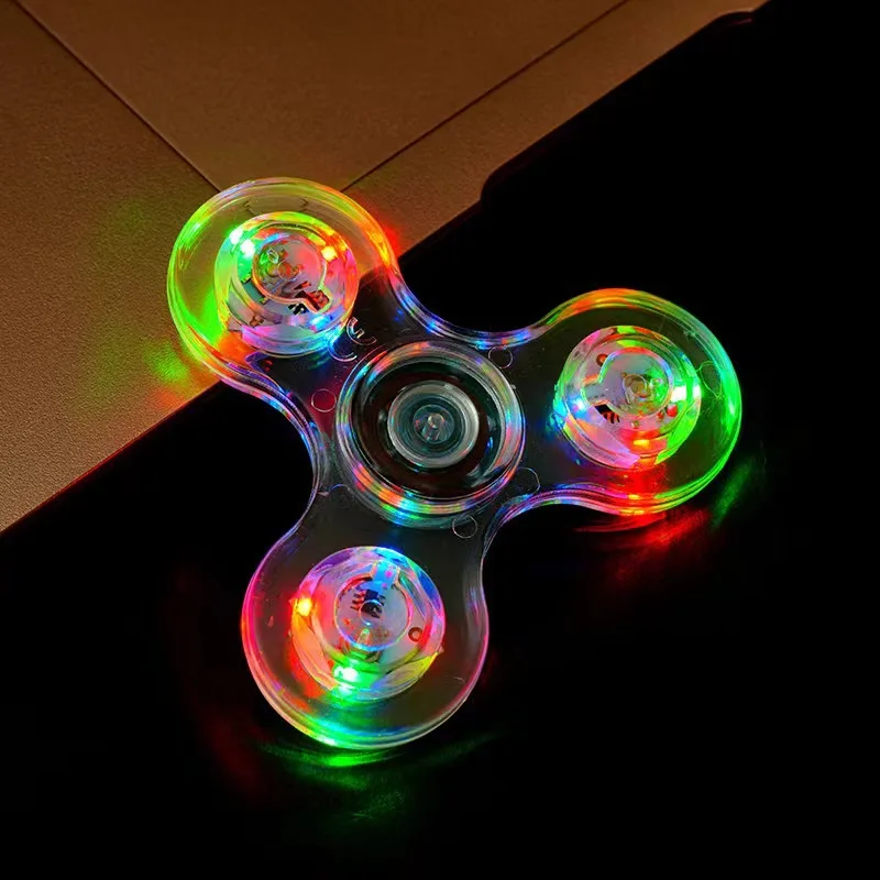 Fidget spinner LED para niños alivia el estrés y brilla en la oscuridad