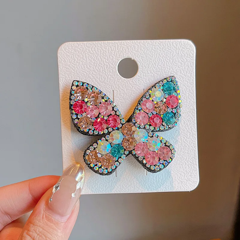 Horquilla infantil con diseño de mariposa y piedras brillantes