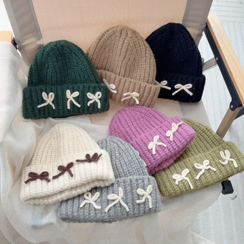 ¡Sombrero de punto suave para niños de estilo coreano! Almohadillas gruesas con bonito lazo, diseño versátil a prueba de viento, cálido y cómodo, elegante.