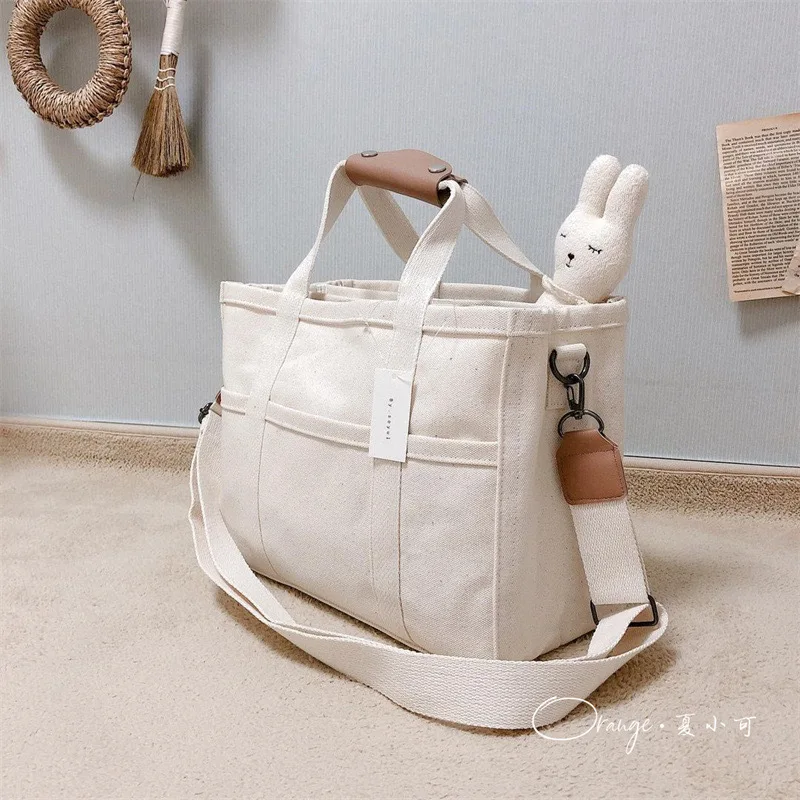 Bolsa de pañales para bebés para mujeres INS simplicidad Color Beige negro bolsa para cochecito portátil de gran capacidad bolsa de almacenamiento de cosas para bebés - imagen 4