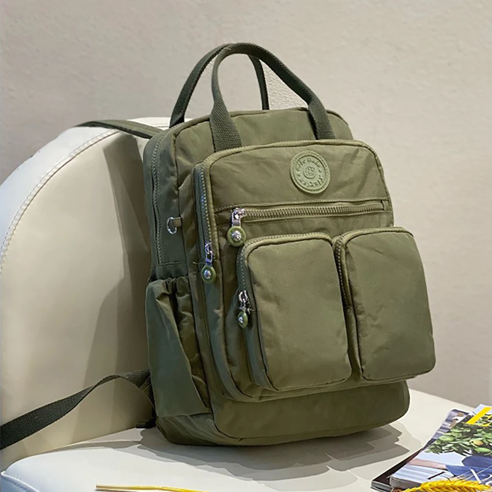 Bolsa de pañales impermeable con bolsillos y porta biberones