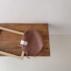 Conjunto bebé jersey de punto y gorro con protección auditiva