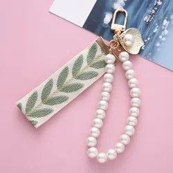 Bolso infantil elegante de hombro con motivo hoja y llavero perla