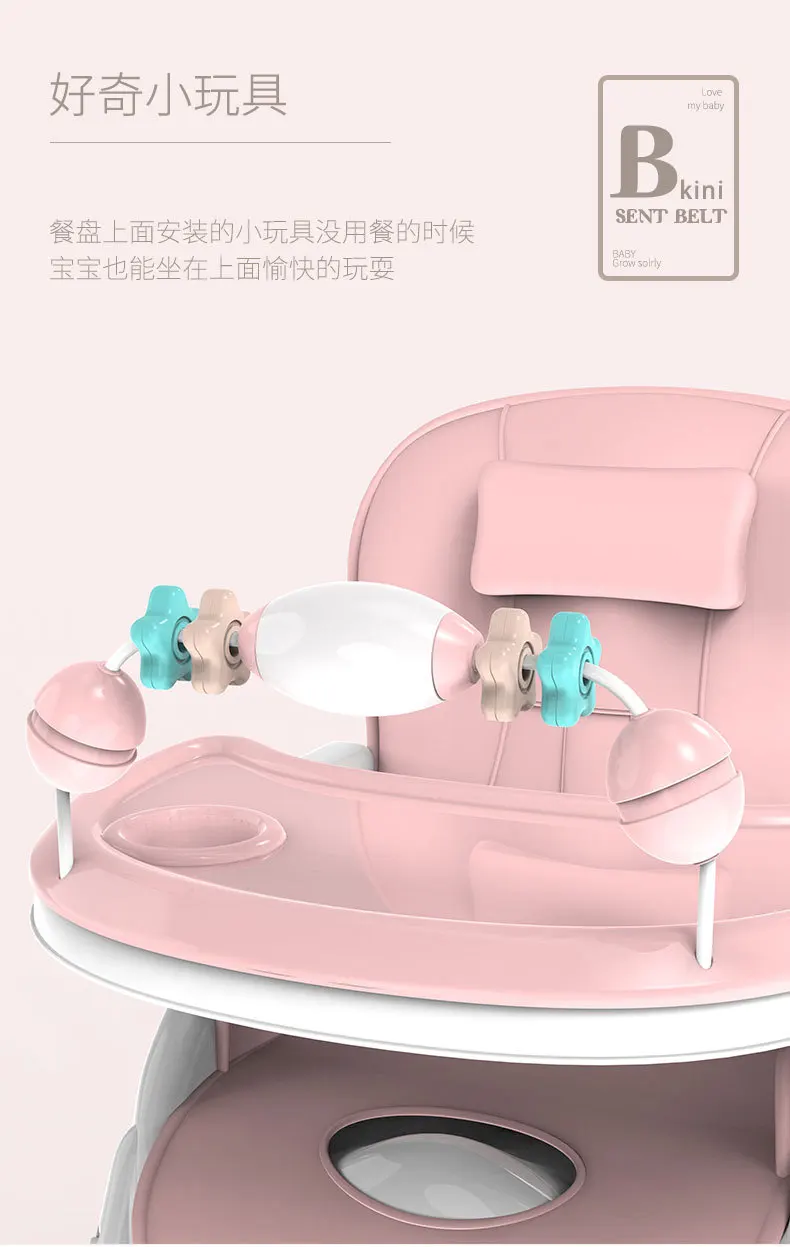 Una silla de bebé rosa con una B